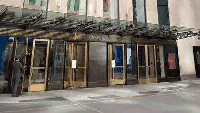 Facade of Christie's auction house, with flags and doorman visible, in Manhattan, New York City, New York, September 15, 2017. (Photo by Smith Collection/Gado/Getty Images)