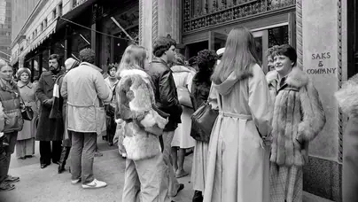 FILE -- Holiday shoppers line up outside Saks Fifth Avenue in Manhattan, Dec. 24, 1978. Saks Fifth Avenue's bankruptcy filing has revived debates about how once celebrated shopping emporiums can regain their luster. (Joyce Dopkeen/The New York Times)