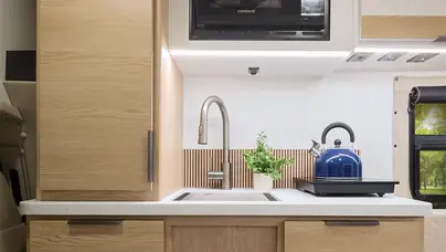 The Thor Motor Coach Rize+ features a well-appointed kitchenette