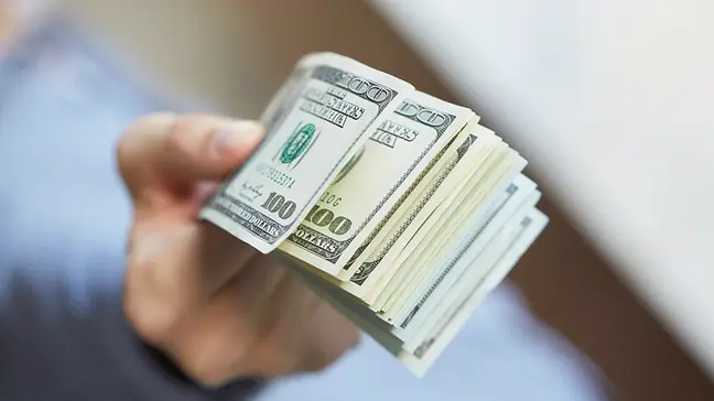 Man with money in hand.