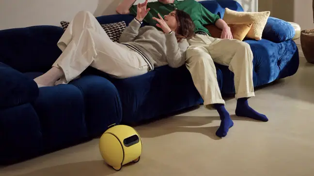 The Samsung Ballie parked near a couch