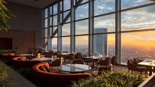 Sunrise through the windows of The Peak Lounge and Bar at Park Hyatt Tokyo